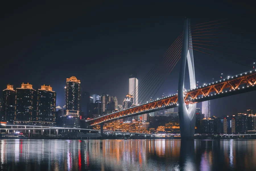 Qiansimen Bridge crossing the Jialing River above Hongya Cave and Chongqing's night skyline