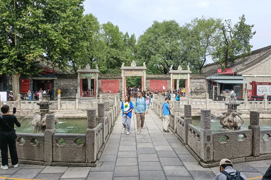 The historic Xi'an Confucian Temple axis at the Forest of Stone Steles Museum, with the stone bridge, ritual pool and Lingxing Gate aligned through the centre.