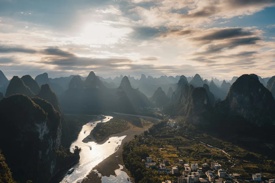 The Li River winding through karst peaks near Guilin in warm morning light