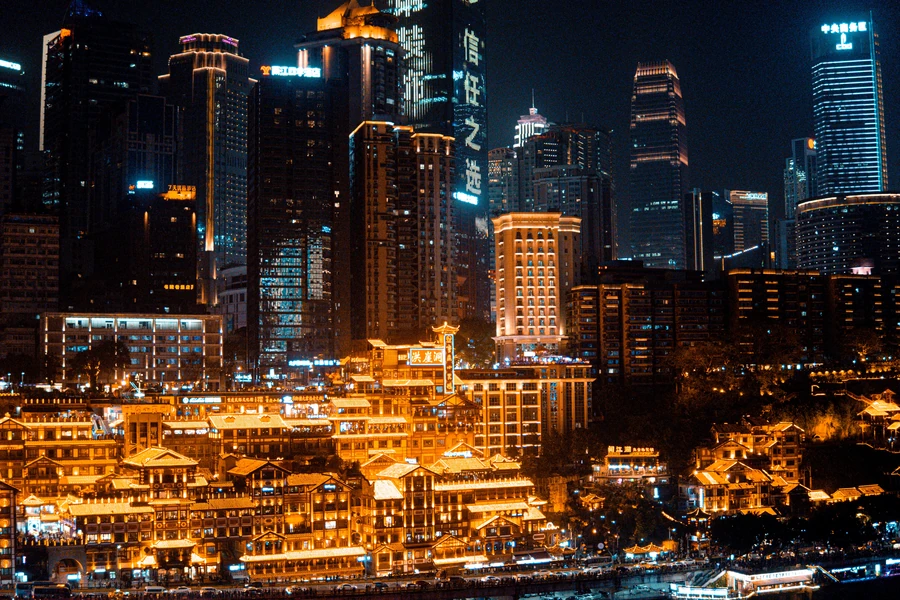 The illuminated full riverfront facade of Hongyadong beneath Chongqing's dense night-time skyline.