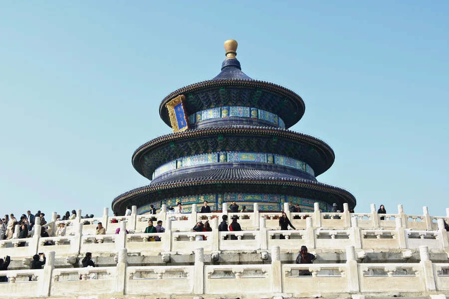The Hall of Prayer for Good Harvests at Beijing's Temple of Heaven, centred above its white marble terraces under a clear blue sky.